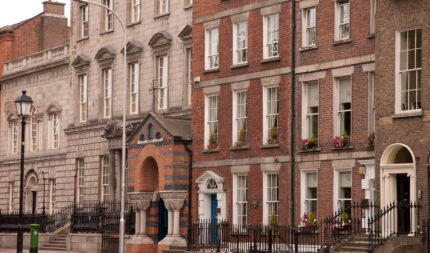 Charming Victorian guesthouse with flower boxes, ideal for a family getaway.